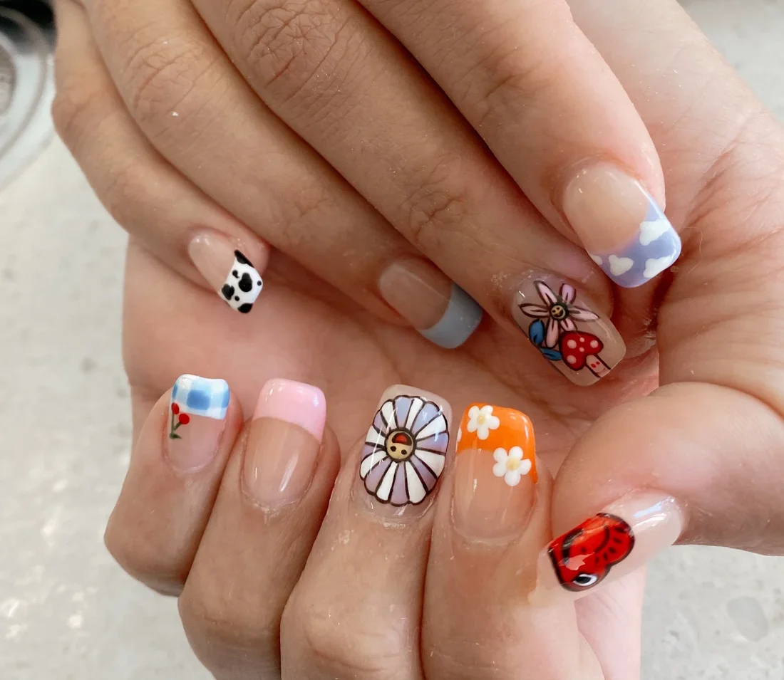 Colorful hand-painted nail art set by Tina Green Nail in Brooklyn
