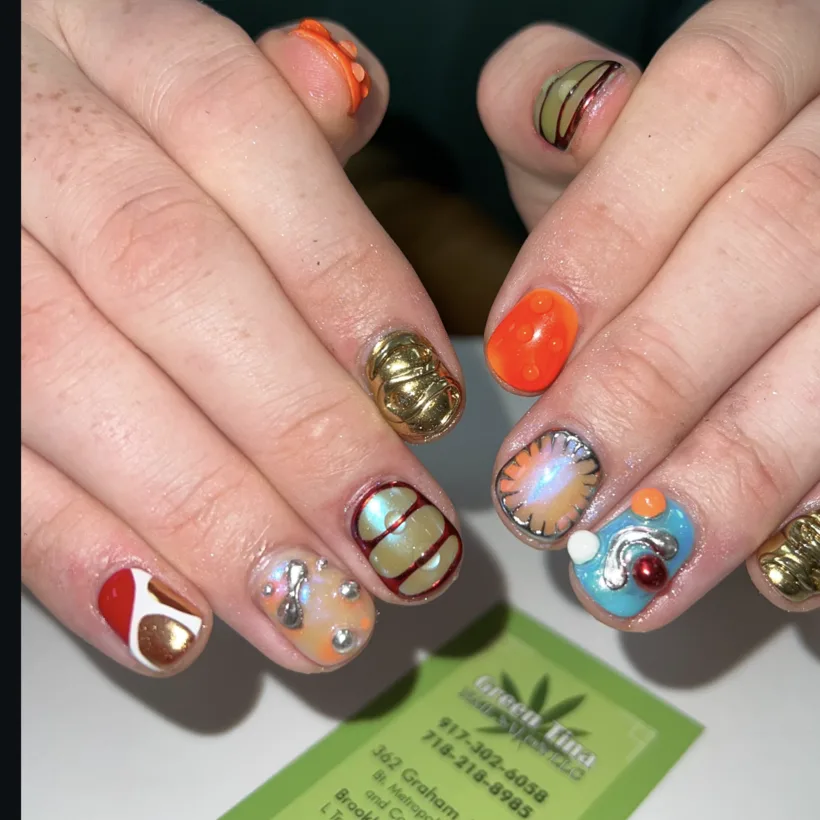 Playful orange and charm nail art by Tina Green Nail