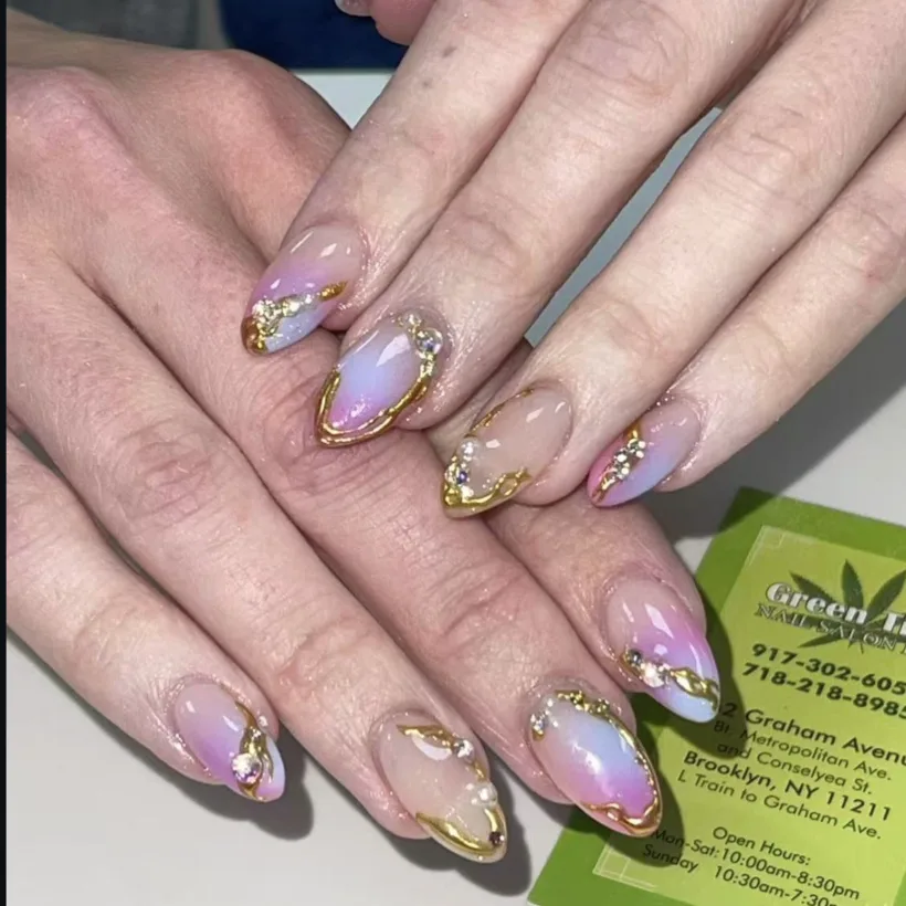 Gold-trim aura almond nails by Tina Green Nail