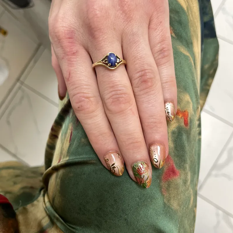 Warm nude nails with hand-painted gold floral art by Tina Green Nail